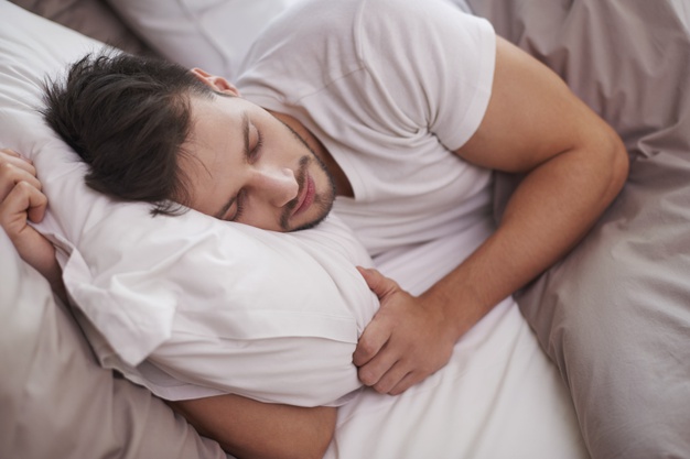 tired-man-resting-bed_329181-3405